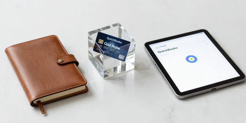 Midjourney prompt: A clean, minimalist desk with three distinct, elegant objects representing finance tools: a classic leather-bound ledger (QuickBooks), a futuristic crystal cube with a credit card suspended inside (Stripe), and a modern tablet showing a banking app logo (Plaid). Soft focus, studio lighting, on a marble surface. --ar 16:9