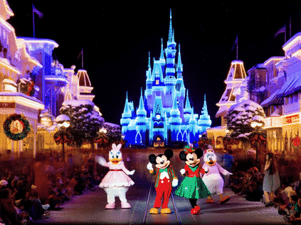 Mickey's Very Merry Christmas Party, Magic Kingdom at night, Main Street USA covered in fake snow, Cinderella Castle glowing