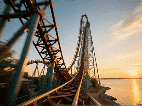 Iconic steel latticework of Cedar Point's Millennium Force roller coaster, first drop diving towards Lake Erie, sense